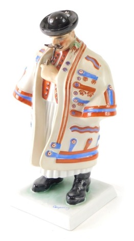 A Herend Hungary porcelain figure of a gentleman, in flowing robes, on square base, polychrome decorated, marked beneath, 32cm high.