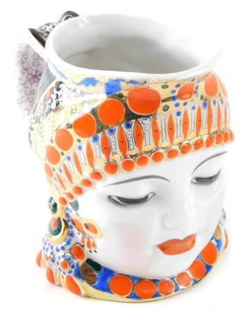 A 1950s Lomonosov Russian face jug, vibrantly decorated, 13cm high.