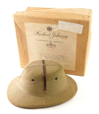 A 20thC Broughams Windsor Colombo Fort pith helmet, with leather embellishments, 14cm high, interior measurement 19cm x 16cm, in associated outer box.