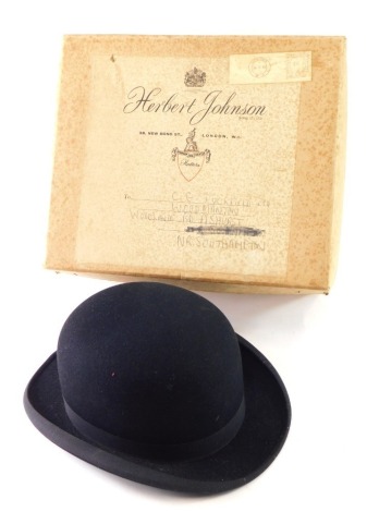 A 20thC Triple Crown Harry Hall bowler hat, in black, interior measurements 20cm x 17cm, in associated Herbert Johnson box.