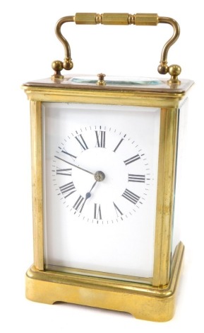 An early 20thC brass minute repeating carriage clock, with 6cm wide back plate, Roman numeric dial, single barrel minute repeating action, striking on a gong, with key, 13cm high.