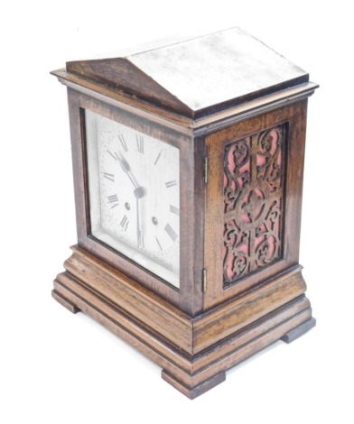 A 19thC mahogany cased mantel clock, the silvered metal 17cm wide Roman numeric dial with etched scroll spandrels, in a pedimented case, on bracket feet, blind fret sides, movement striking on one gong on the hour and half hours, numbered 865656 and marke