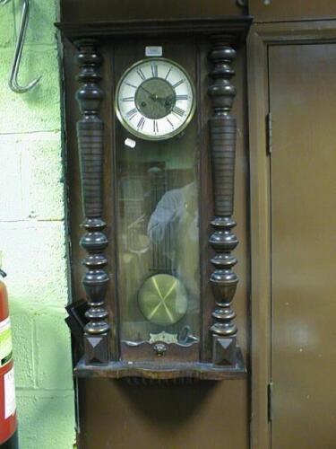 A 19thC Vienna wall clock with embossed brass dial