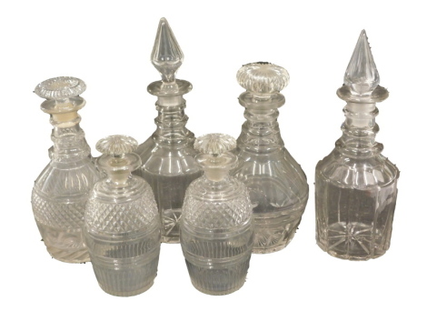 Various 19thC decanters, to include a matched pair with compressed mushroom stoppers, with ring stems and shaped bodies, 27cm high, two smaller hobnail cut and plain glass decanters with compressed stems, and two others. (6)