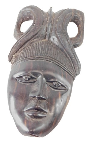 An African tribal carved wooden wall face mask, 31cm high.