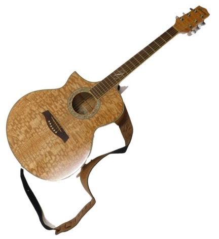 An Ibanez Electro acoustic guitar, with shaped case, no.EW20LASE-NT1202, serial number S110700649, with chrome mounts, left handed, 98cm long.