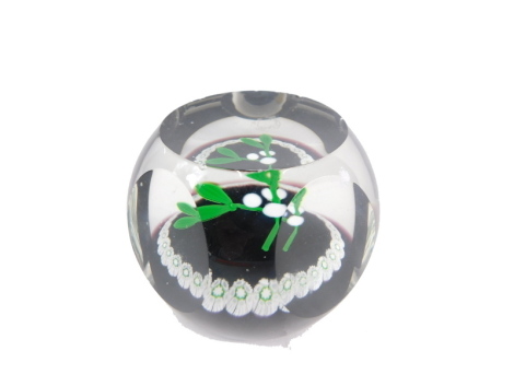 A William Mason limited edition Caithness paperweight, number 366/500, decorated with flowers in green, white, black and clear glass, 7cm high.