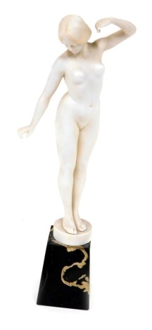 An Art Deco parian figure of a standing nude lady, on marble base, unsigned, 29cm high.