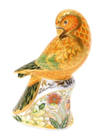 A Royal Crown Derby paperweight ornament Sun Parakeet, gilt stopper, printed marks beneath, 16cm high.