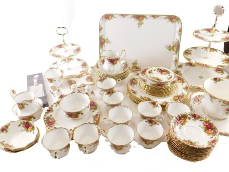 Various Royal Albert Old Country Roses dinner and tea ware, to include a three tier graduated cake stand, 40cm high, shoe ornaments, plates, side plates, two tier cake stand, jardiniere, etc., printed marks beneath. (70 plus pieces)