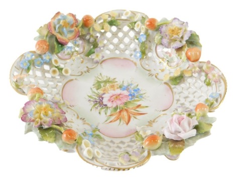 A 20thC Continental porcelain dish, profusely decorated with flowers, double X mark beneath, 22cm wide.