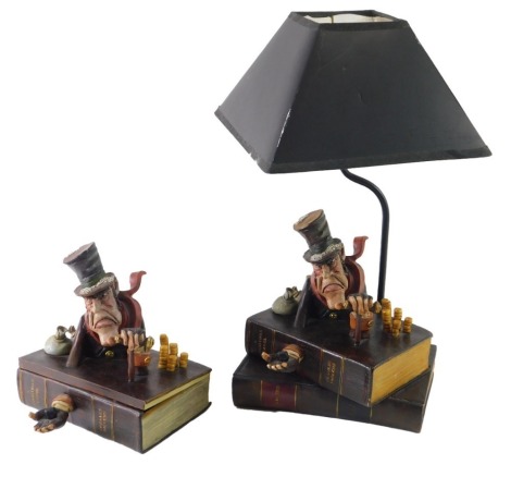 A Charles Dickens inspired grotesque pottery book shaped box, 20cm wide, and a similar table lamp. (2)