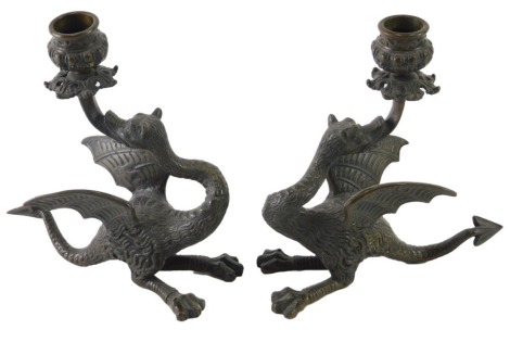 A pair of bronze dragon candlesticks, unsigned, 20cm high.