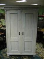 A drag painted pine two door armoire