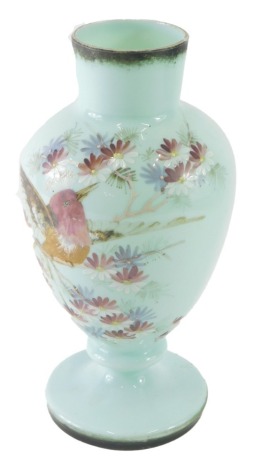 A late 19thC glass vase, hand painted with bird and flowers, on a turquoise ground, 33cm high.