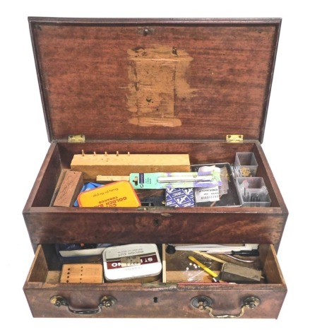 An early 19thC mahogany box, with front drawer, containing a quantity of tins, craft items, etc., 21cm high.