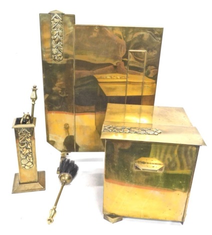 A mid 20thC Art Deco brass fire side set, comprising coal box, guard, 60cm high, and companion set. (a quantity)