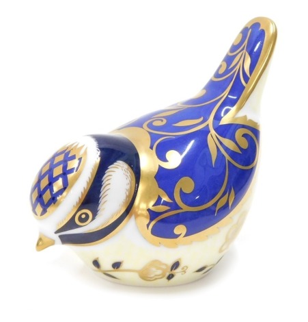 A Royal Crown Derby paperweight ornament Wye Blue Tit, gilt stopper, printed marks beneath, 6cm high.