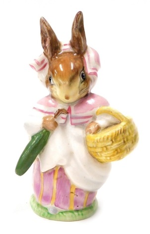 A Beswick Beatrix Potter figure Mrs Rabbit, gold oval mark, 10cm high.