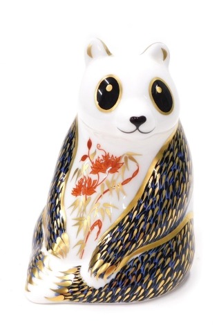 A Royal Crown Derby paperweight ornament Panda, octagonal stopper, printed marks beneath, 12cm high.