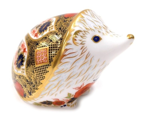 A Royal Crown Derby paperweight ornament Old Imari Hedgehog, gilt stopper, printed marks beneath, 9cm high.