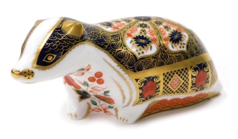 A Royal Crown Derby paperweight ornament Old Imari Badger, gilt stopper, printed marks beneath, 7cm high.