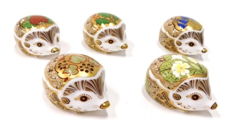 A set of five Royal Crown Derby paperweight ornaments Hedgehogs, to include Ivy, gilt stopper, printed marks beneath, 4cm high, etc. (5)