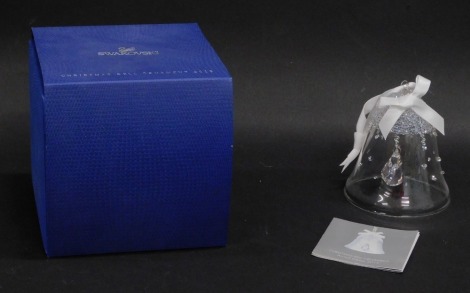 A Swarovski crystal Christmas bell ornament 2015, 9cm high, boxed with paperwork.