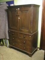 A Georgian mahogany Press Cupboard with dentil moulded cornice over 2