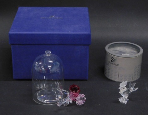 A Swarovski crystal tricoloured flower group under dome, 10cm high, boxed (AF), and a Swarovski crystal cockerel. (2)