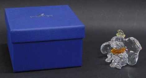 A Swarovski crystal bicoloured figurine Dumbo, 7cm high, boxed.