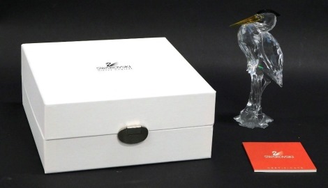 A Swarovski crystal bicoloured figurine stork, 15cm high, boxed with paperwork.