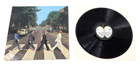 A Beatles Abbey Road album, 1-3 stereo pcs7088yex.750 and yex749a-3u in paper cover and outer sleeve.