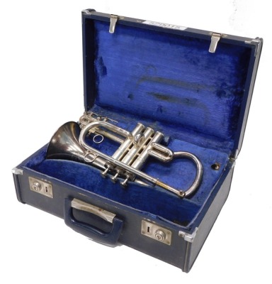 An F & B Besson New Standard cornet, three valves, 32cm long, cased.