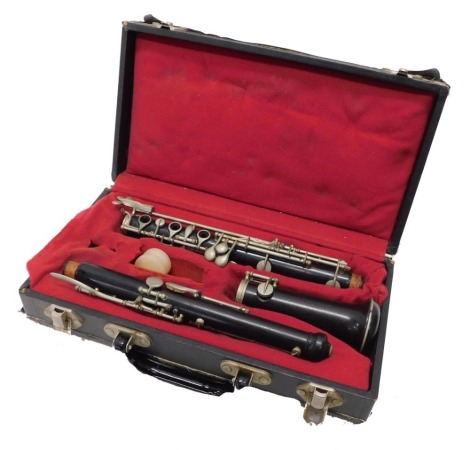 A three piece F. Buisson oboe, with chrome valves, the case 33cm long.