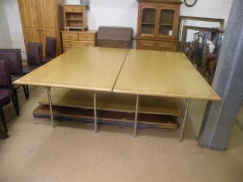 A modern veneered boardroom/conference table with an ebonised stringing on cast metal legs