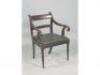 A 19thC mahogany open armchair with a padded seat on turned tapering