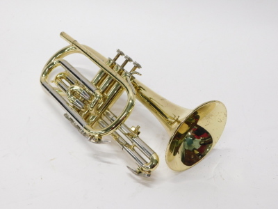 A Blessing brass cornet, with three valves, 37cm long, with separate mouthpiece. (cased) - 2