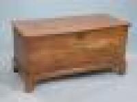 A 19thC elm blanket chest on bracket feet