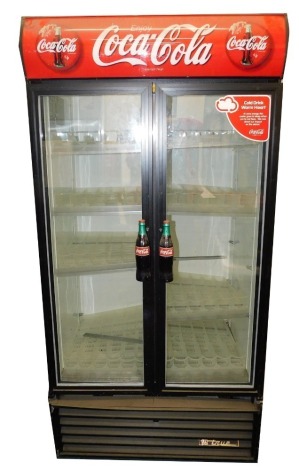 A Coca-Cola advertising fridge, with two doors, number 1849830, with condition B cooler, 210cm high. (AF) VAT is payable on the hammer price of this lot.