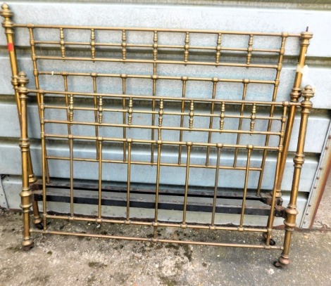 A Victorian brass half tester bed, with cylindrical posts and spindle supports, 153cm wide. (AF) This lot is located at Oundle, Near Peterborough, PE8, viewing and collection by appointment only by calling our Lincoln office 01522 524984.