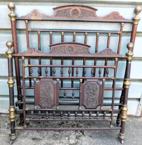 An unusual late 19thC mahogany and brass bed head and foot, with carved crests, cylindrical frame, etc., 145cm wide. This lot is located at Oundle, Near Peterborough, PE8, viewing and collection by appointment only by calling our Lincoln office 01522 5249