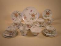 A Shelley part tea service decorated with flowers and leaves