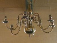 A Continental brass six branch chandelier cast with leaves and scrolls