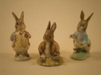 Three Royal Albert Beatrix Potter figures of Benjamin Bunny sat on a bank