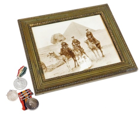 A Boer War Queens South Africa Medal, named to Pte J Seddons, 1st Loyal North Lancashire Regiment M.I., 5086, with clasps for Oramge Free State and Cape Colony, together with a late 19thC photograph of three British soldiers, mounted on camels in Egypt, S