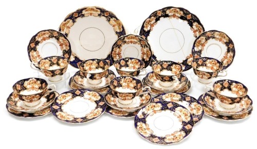 A Royal Albert porcelain Heirloom pattern part tea service, comprising pair of bread plates, eight teacups, saucers, and tea plates.