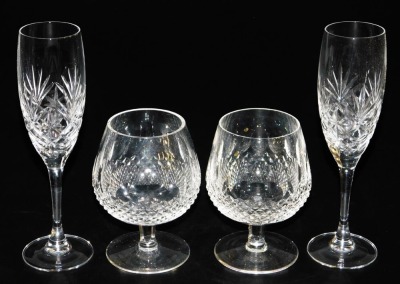 A pair of Waterford Crystal Colleen pattern brandy balloons, together with a pair of Royal Doulton crystal champagne flutes, boxed. (4)