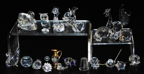 A group of Swarovski and other crystal ornaments, including a hippopotamus, squirrel, standing cat, hedgehog and a puffer fish. (a quantity)