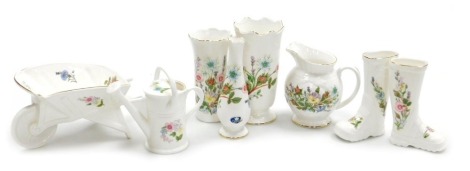 A group of Aynsley Wild Tudor pattern porcelain ornaments, including a wheelbarrow, pair of Wellington boots, vases, watering can, and a jug. (7)